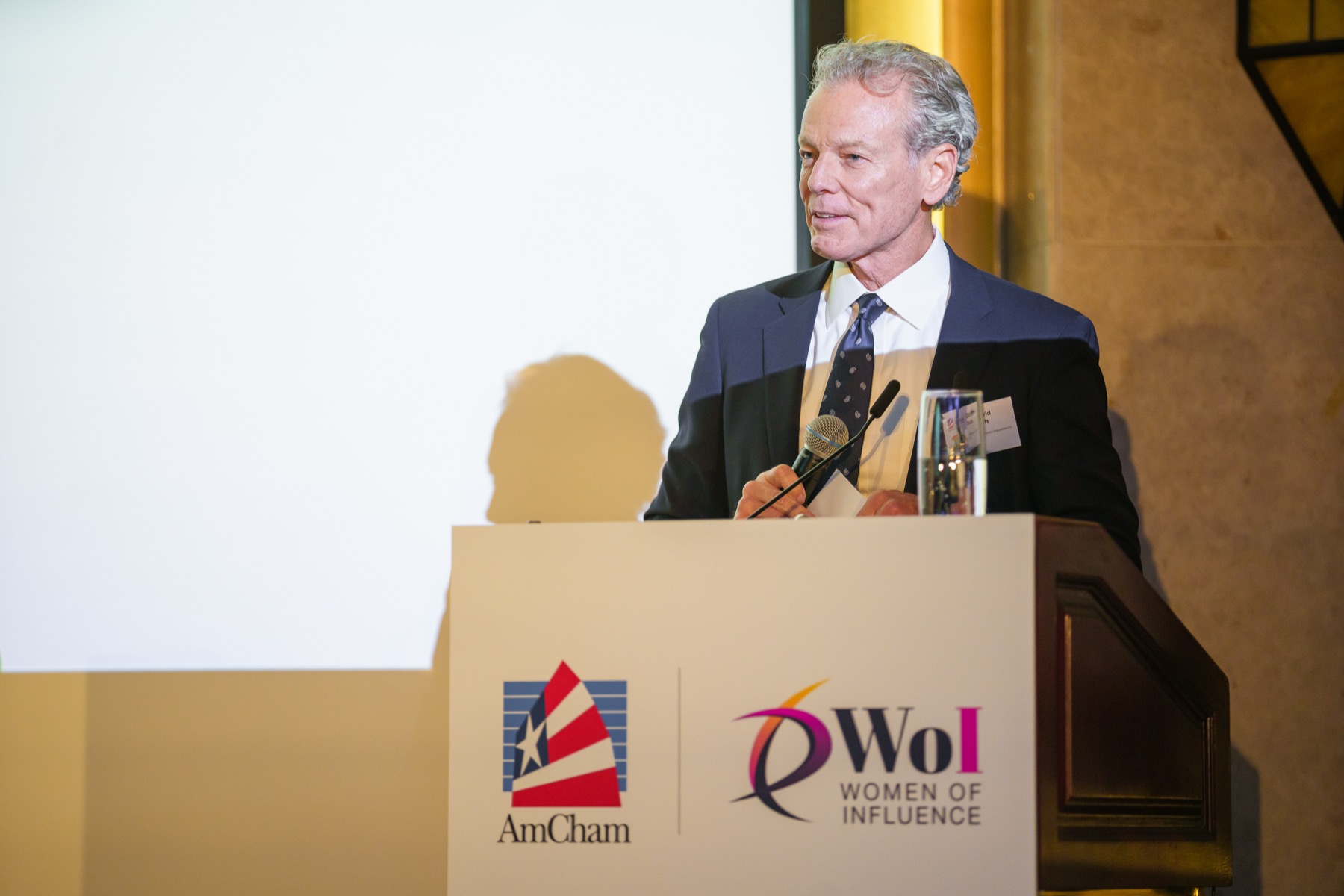 A speaker at the lectern at the 22nd Women of Influence Awards Gala